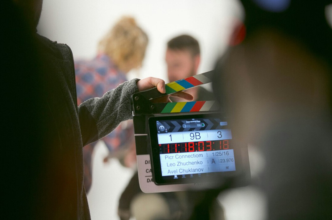 film crew reviewing footage